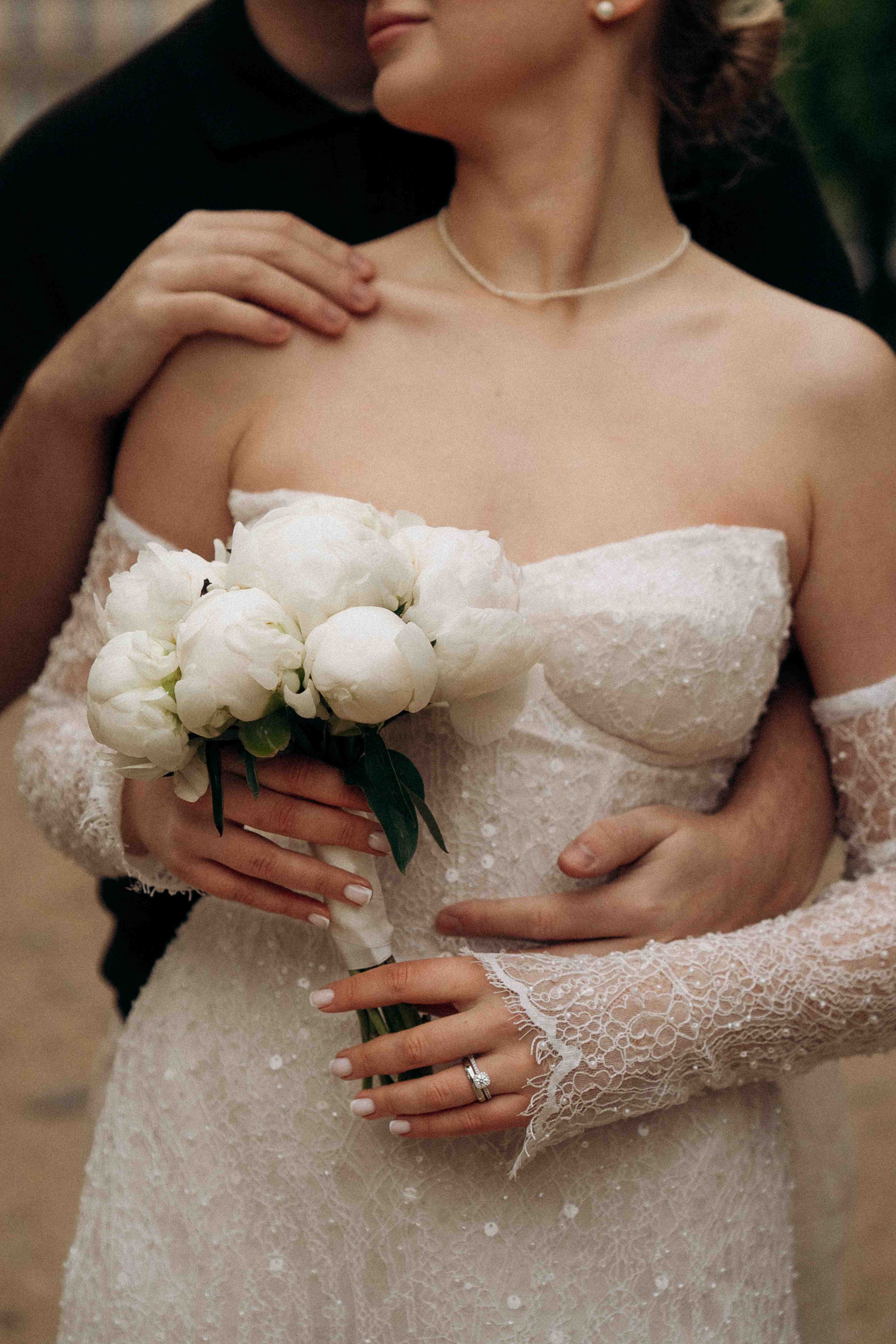 Close view of the lace corset cups and separate lace sleeves